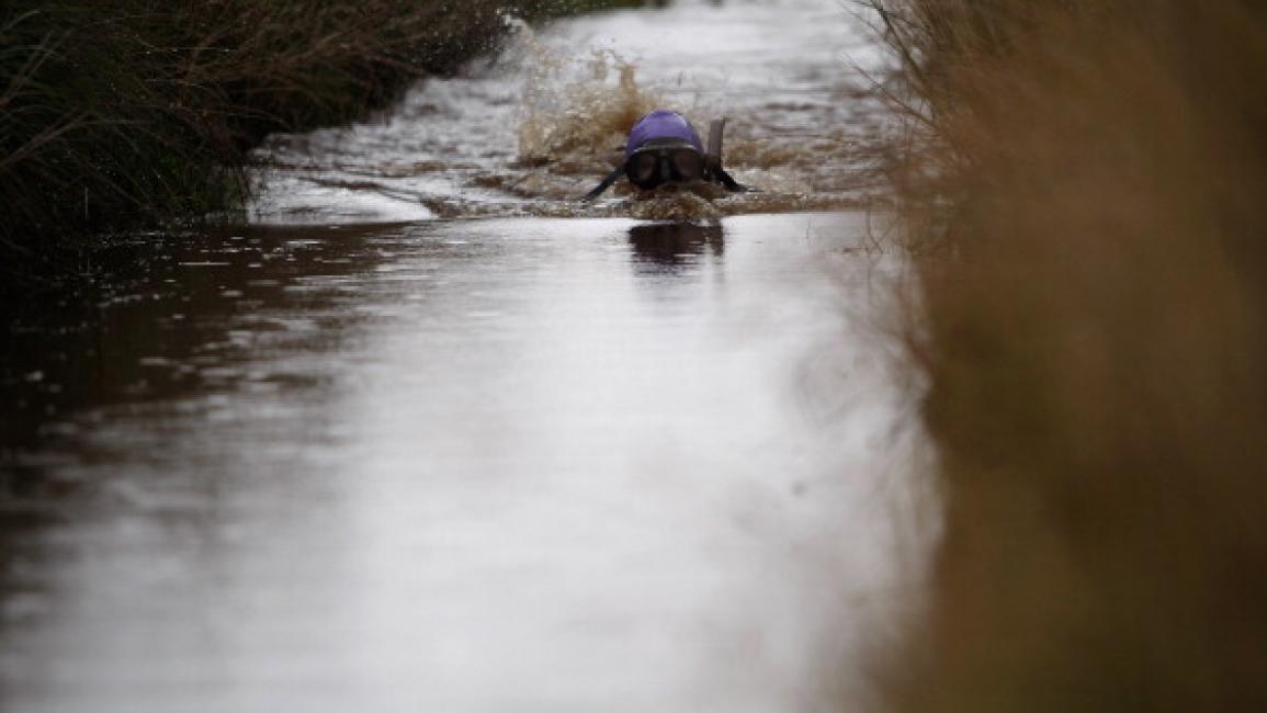 LLANWRTYD WELLS, WALES - AUGUST 28: A competitor snorkles during the World Bog Snorkelling Championships on August 28, 2011 in Llanwrtyd Wells, Wales. In 2012, following the Olympic Games, Llanwrtyd Wells will host the inaugural World Alternative Games. (Photo by Harry Engels/Getty Images)	