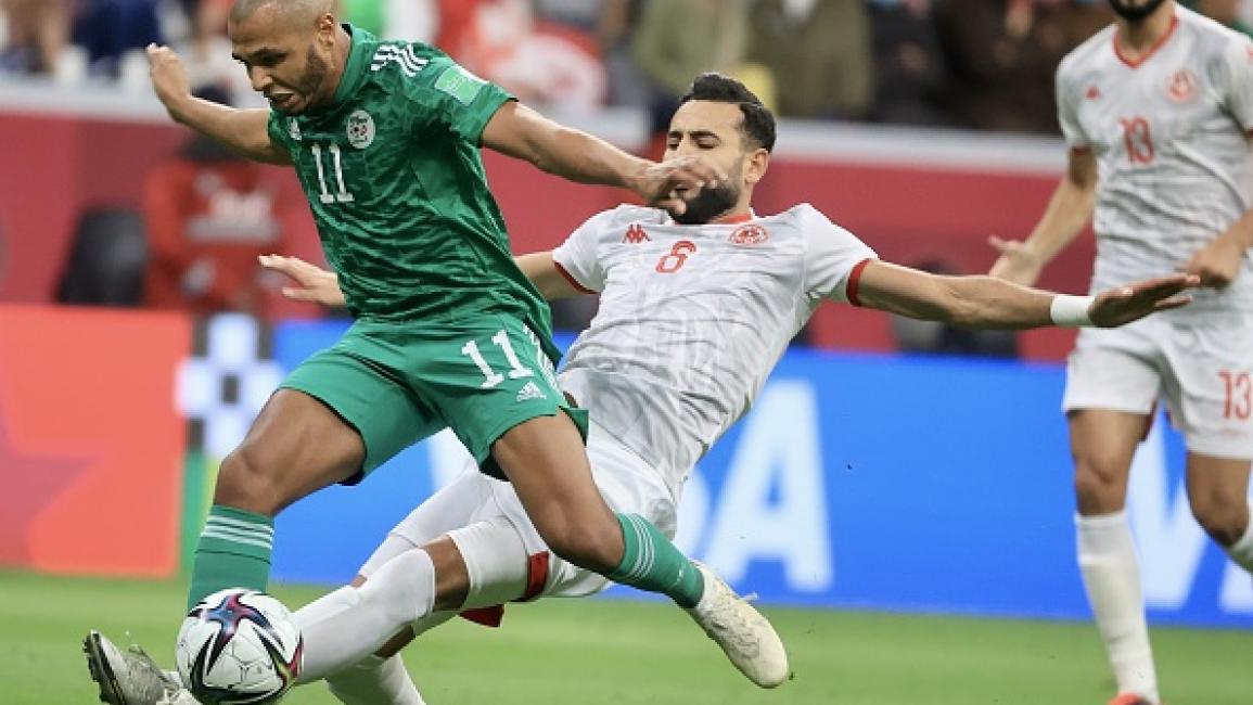 AL KHOR, QATAR - DECEMBER 18: Gaylen es-Seglali (R) of Tunisia in action against Yacine Brahimi (11) of Algeria during the FIFA Arab Cup final match between Tunisia and Algeria at Al Bayt stadium in Al Khor, Qatar on December 18, 2021 (Photo by Mohammed Dabbous/Anadolu Agency via Getty Images)	