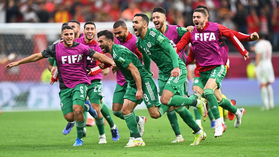 Algeria's forward Amir Sayoud (C) celebrates with teammates after scoring the opening goal during the FIFA Arab Cup 2021 final football match between Tunisia and Algeria at the Al-Bayt stadium in the Qatari city of Al-Khor on December 18, 2021. (Photo by JACK GUEZ / AFP) (Photo by JACK GUEZ/AFP via Getty Images)