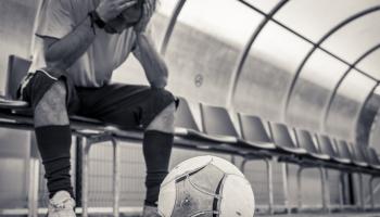 Getty-Soccer player sitting on bench