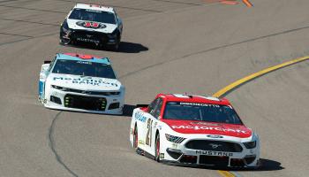 PHOENIX, AZ - MARCH 14: Matt DiBenedetto, driver of the #21 Wood Brothers Racing Motorcraft/Quick Lane Ford Mustang, races in front of Erik Jones, driver of the #43 Richard Petty Motorsports Medallion Bank Chevrolet Camaro, during the Instacart 500 Nascar Cup Series Race on March 14, 2021 at Phoenix ISM Raceway in Phoenix, Arizona. (Photo by Kevin Abele/Icon Sportswire via Getty Images)