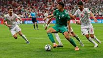 Algeria's forward Baghdad Bounedjah (C) controls the ball during the FIFA Arab Cup 2021 final football match between Tunisia and Algeria at the Al-Bayt stadium in the Qatari city of Al-Khor on December 18, 2021. (Photo by JACK GUEZ / AFP) (Photo by JACK GUEZ/AFP via Getty Images)