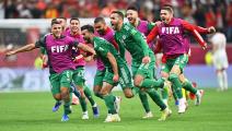 Algeria's forward Amir Sayoud (C) celebrates with teammates after scoring the opening goal during the FIFA Arab Cup 2021 final football match between Tunisia and Algeria at the Al-Bayt stadium in the Qatari city of Al-Khor on December 18, 2021. (Photo by JACK GUEZ / AFP) (Photo by JACK GUEZ/AFP via Getty Images)